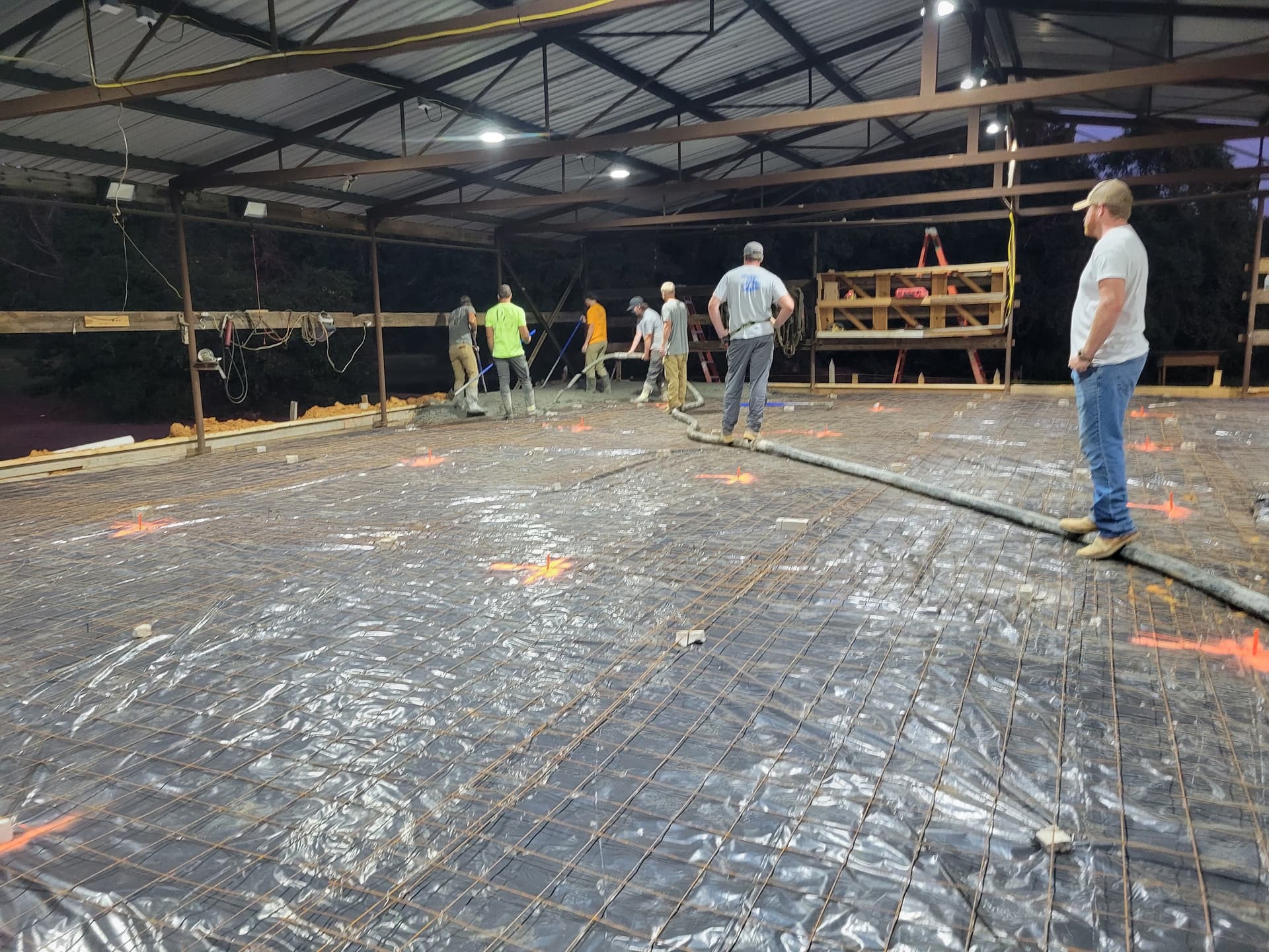 Concrete Floor Pour Inside a Large Steel Frame Building image