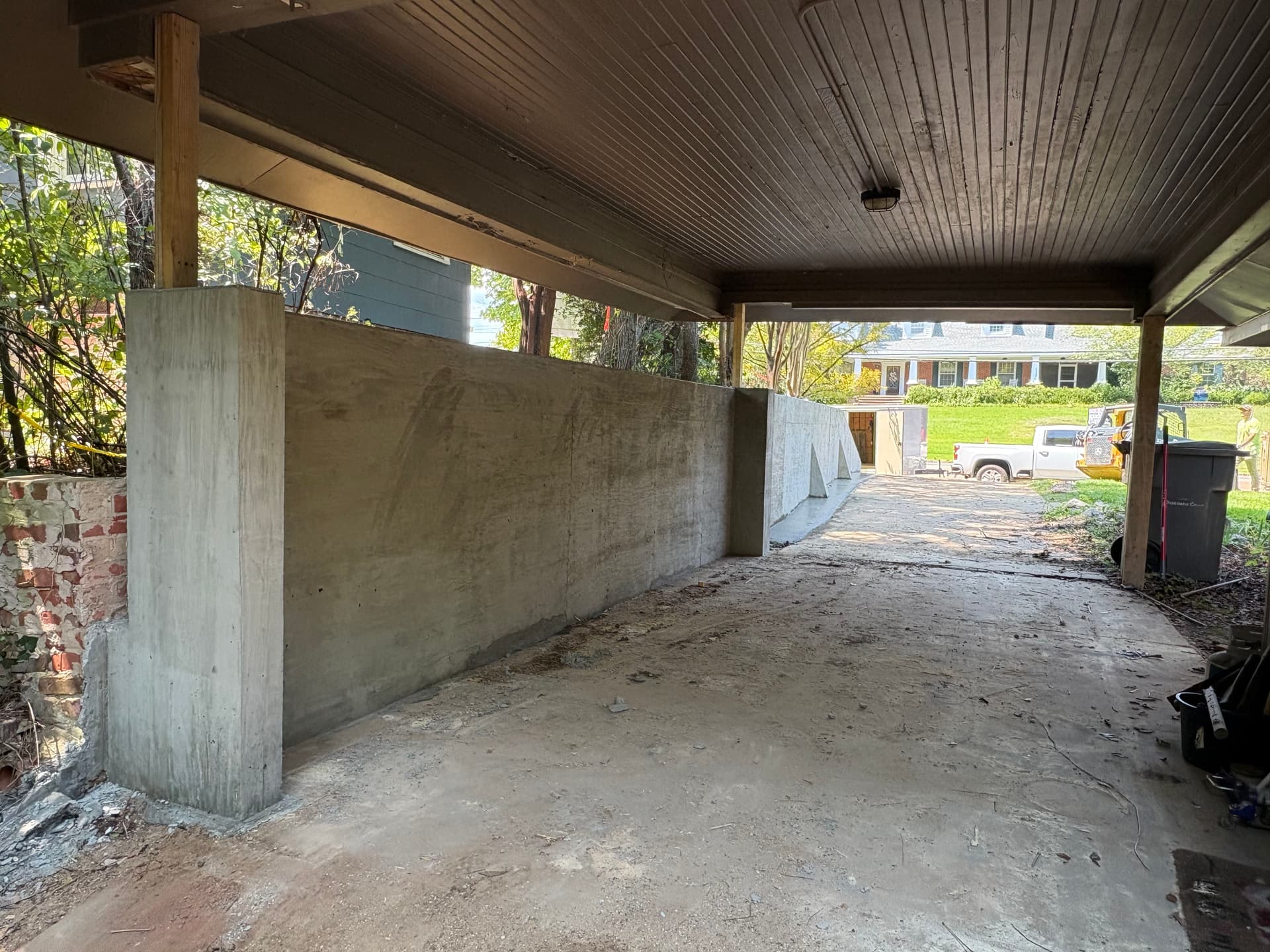 Gallery photos for Poured Concrete Retaining Wall Built to Hold Grade Along a Driveway: Image #2